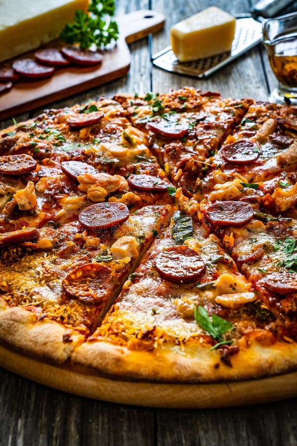 Circle Pizza Chorizo with Chicken Nuggets and Mozzarella, on Wooden