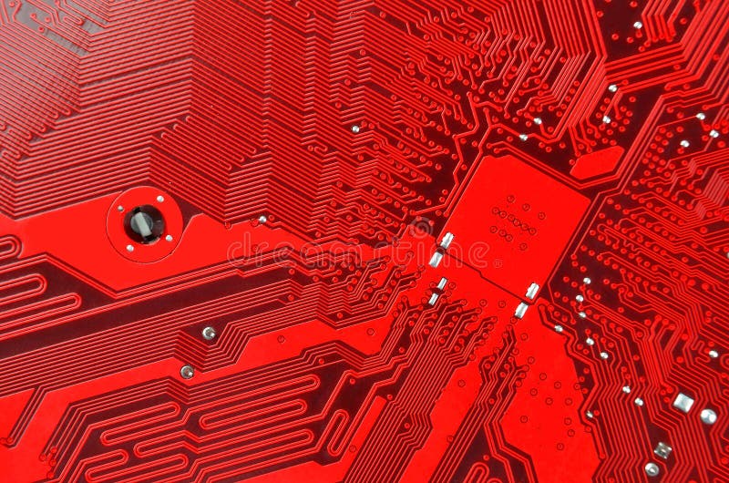 Circuit board background. Close up of a printed red computer circuit board