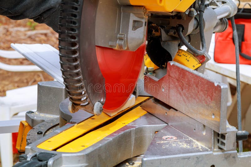 Circular Saw. Carpenter Using Circular Saw for Wood Beam Stock Image