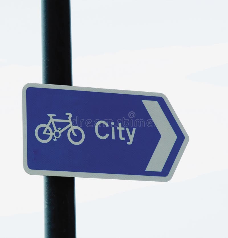 A signpost indicating cycleroute in city. A signpost indicating cycleroute in city