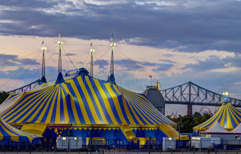 Tents of Le Cirque du Soleil in Old Port of Montreal, with the Jacques Cartier Bridge and the Ferris Wheel from LaRonde in the background. Tents of Le Cirque du Soleil in Old Port of Montreal, with the Jacques Cartier Bridge and the Ferris Wheel from LaRonde in the background