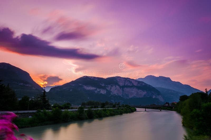 The ciry of Trento in Italy as seen from one of its many bridges during the blue hour, just after sunset. The ciry of Trento in Italy as seen from one of its many bridges during the blue hour, just after sunset.