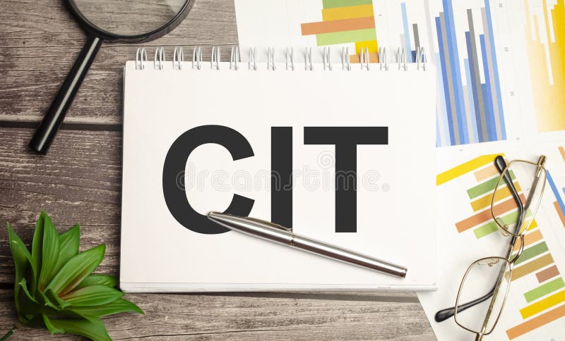 CIT. magnifier on brown notepad text on magnifier glass. Notepad composition stock images, royalty-free photos and pictures