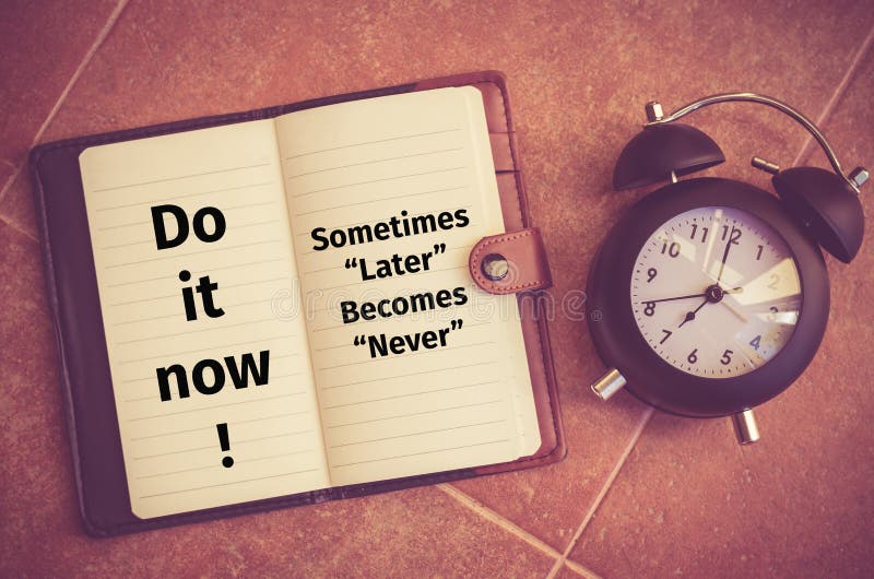 Inspiration quote : Do it now ! Sometimes later becomes never on notebook and clock on the floor. Inspiration quote : Do it now ! Sometimes later becomes never on notebook and clock on the floor