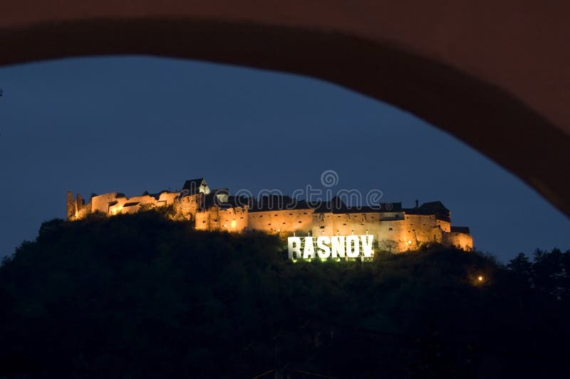 Romania Medieval citadel from Transylvania called Rasnov by night. Romania Medieval citadel from Transylvania called Rasnov by night