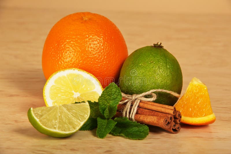 Citrus, connected sticks of cinnamon and mint