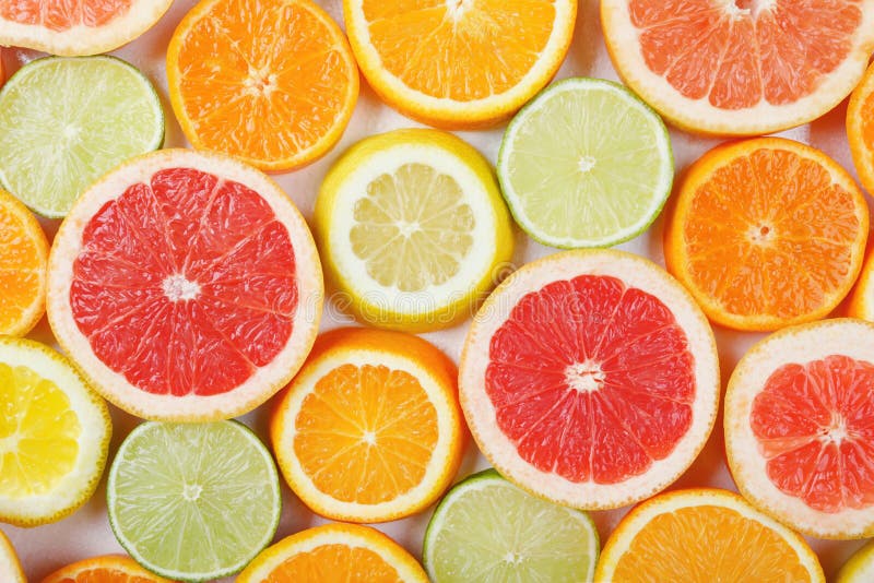 Citrus fruit pattern made of lemon, orange, grapefruit and lime. Flat lay, top view.