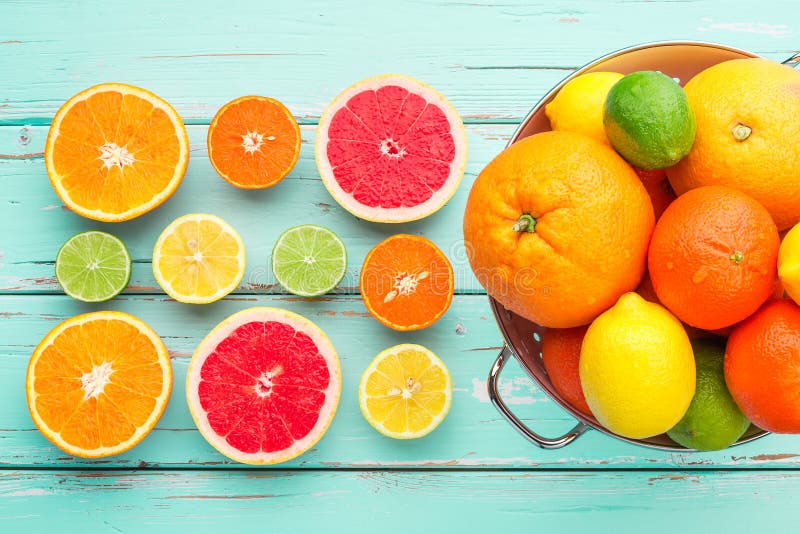 Citrus fruits in retro colander.