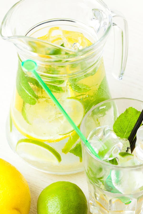 Citrus Lemonade in Pitcher and Glass , Closeup Stock Photo Image of