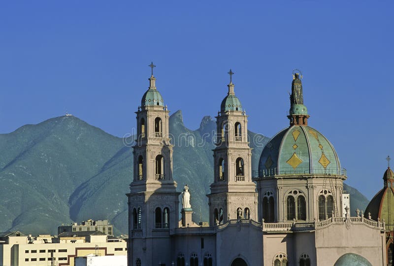 Church of Our Lady of Perpetual Help, in the background the horse saddle mountain (cerro de la silla) at the city of Monterrey in Mexico. Church of Our Lady of Perpetual Help, in the background the horse saddle mountain (cerro de la silla) at the city of Monterrey in Mexico.
