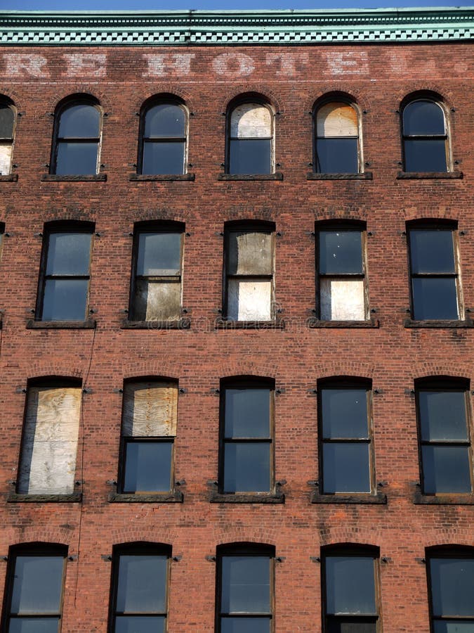 City: brick wall of derelict hotel