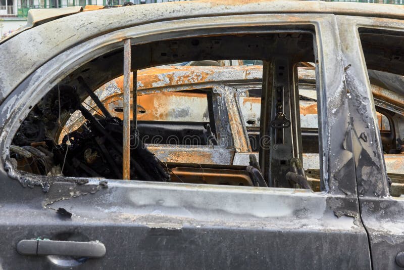 City burned cars after a fire in one of the city`s districts. City burned cars, some details after a fire in one of the city`s districts royalty free stock photo City burned cars after a fire in one of the city`s districts. City burned cars, some details after a fire in one of the city`s districts royalty free stock photo