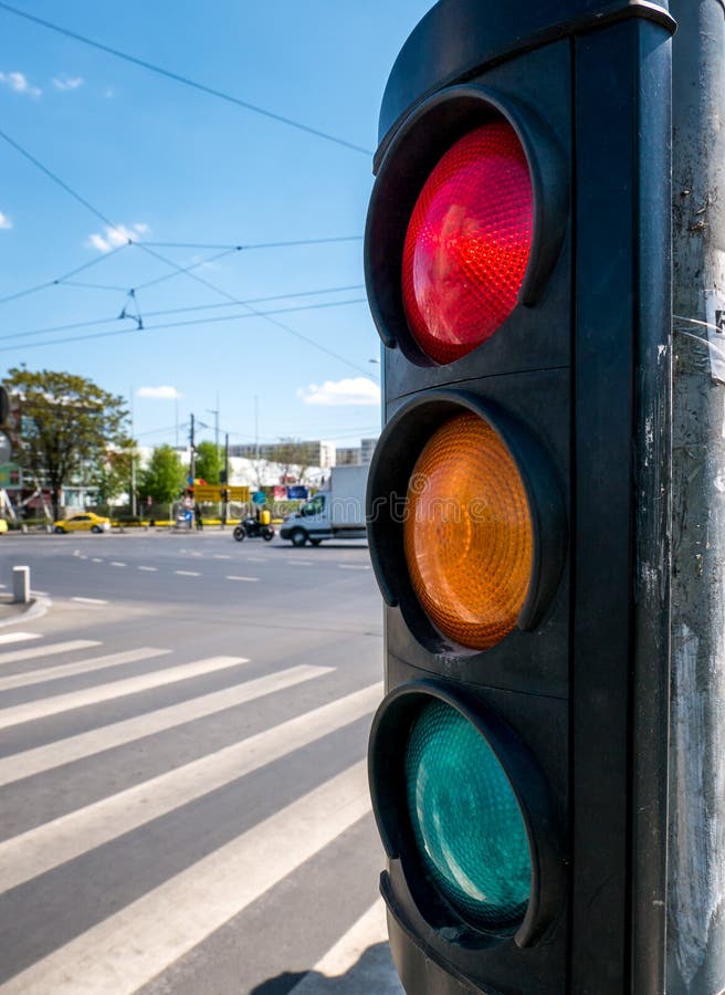 A city crossing with a semaphore indicating red light stock photo A city crossing with a semaphore indicating red light stock photo