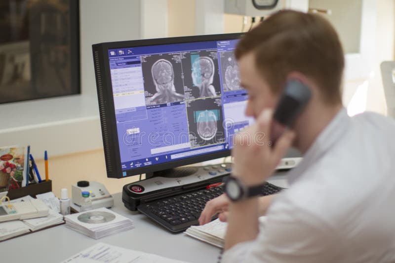 City of Gomel, Belarus 31 May 2017.City hospital. The doctor makes magnetic resonance therapy. Medical examination of the body. Computer diagnosis of the brain