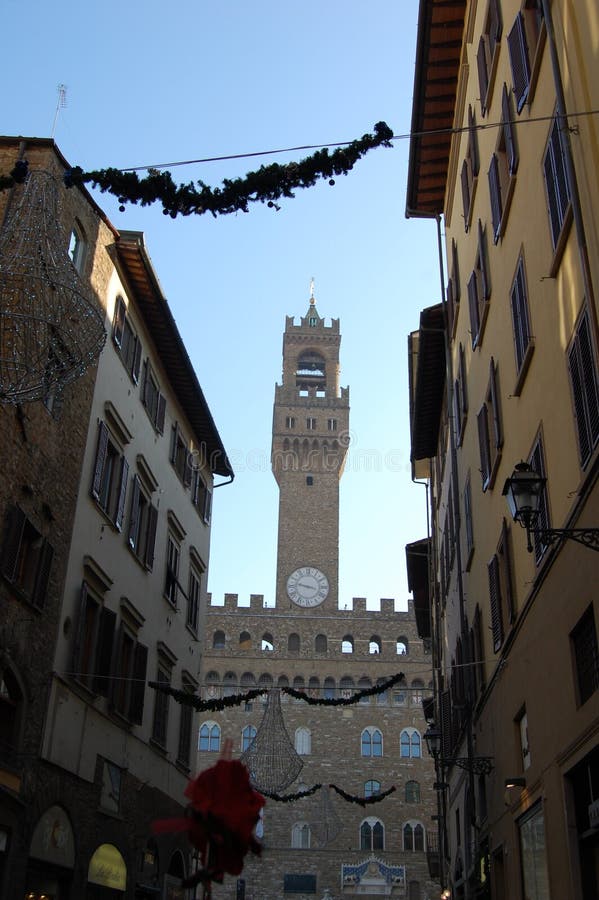 City Hall in Florence, the clock tower. Ancient buildings with shutters on the windows. royalty free stock photography City Hall in Florence, the clock tower. Ancient buildings with shutters on the windows. royalty free stock photography