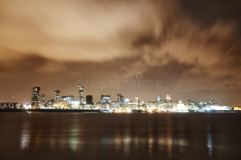 City of Liverpool, England, at night and the river Mersey