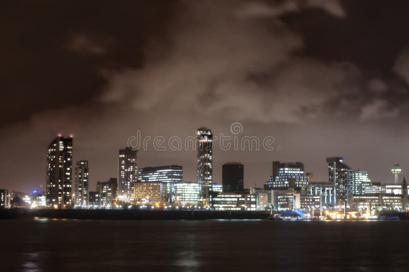 City of Liverpool, England, at night and the river Mersey