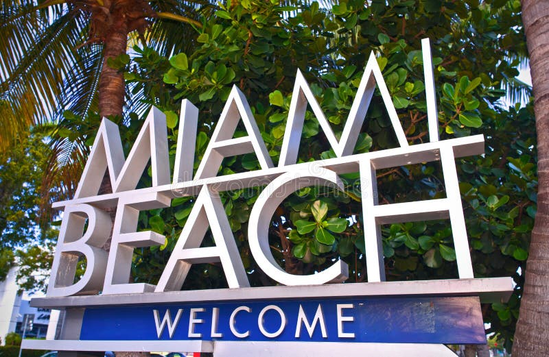 City of Miami Beach Florida welcome sign with palm trees on a sunny summer day