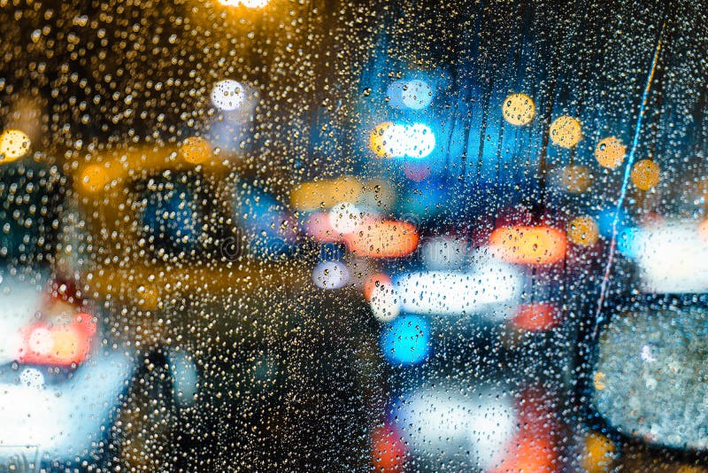 City Night Bokeh car windshield. Rain Drops on window with light bokeh effect. Window color reflection background stock images, royalty-free photos and pictures