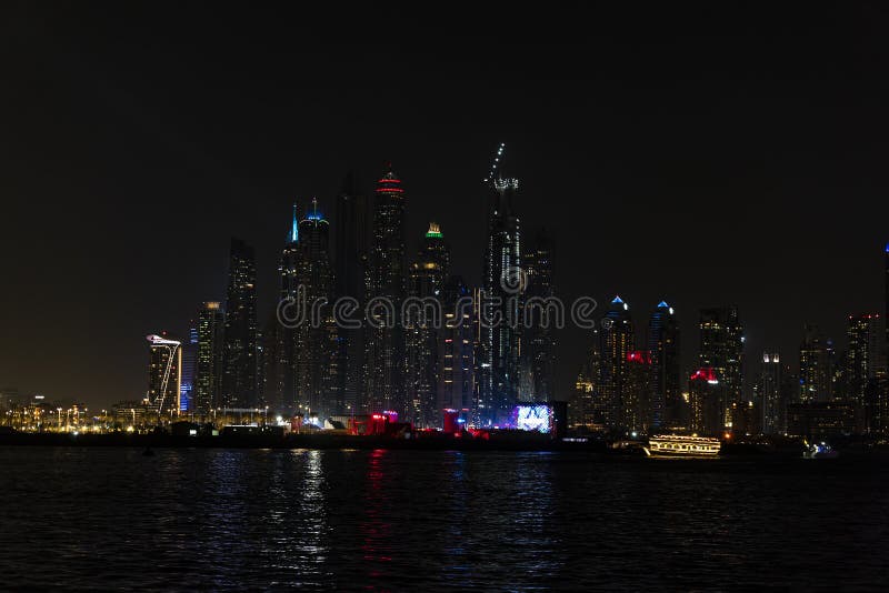City at Night, Panoramic Scene of Downtown Reflected Dubai Stock Photo