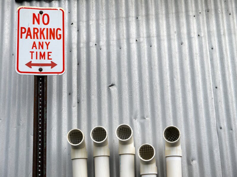 City: No Parking sign with pipes