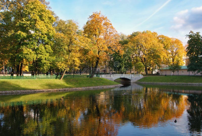 City park with a bridge and a pond.