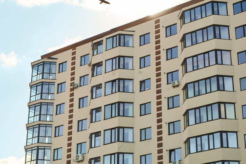 City real estate. Simple condo architecture. New residential apartment condominium type. Block of flats. View of modern sand