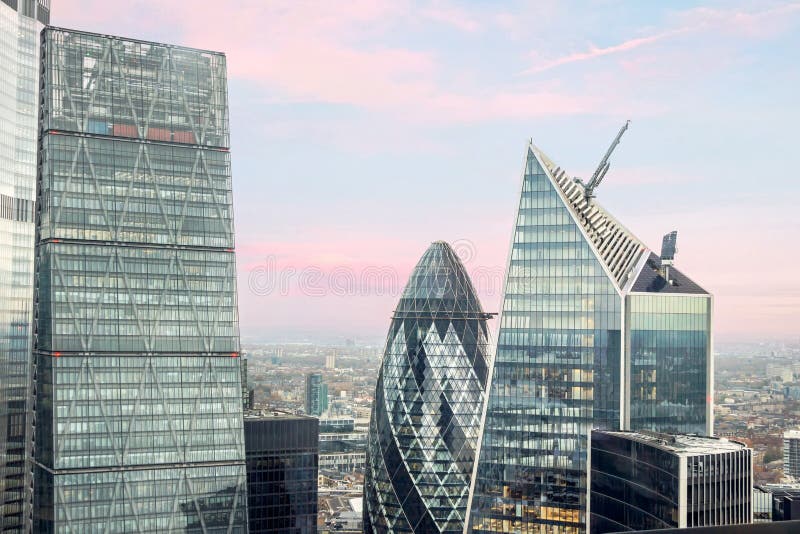 Cityscape of gherkin building with blue sky at central London stock photos