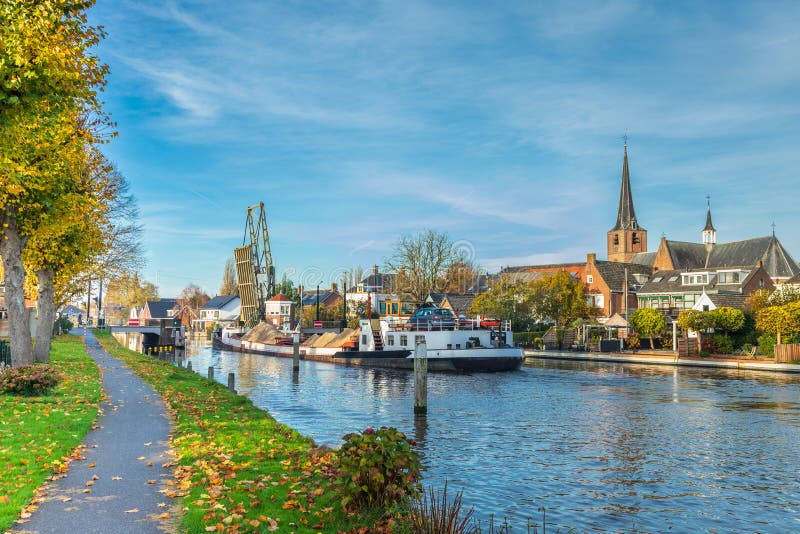 Koudekerk Aan Den Rijn Cityscape of Koudekerk Aan Den Rijn with Sailing Sand Loaded Ship on