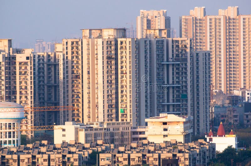 Cityscape in indian city like noida gurgaon delhi. Cityscape with skyscrapers smaller apartment, water tower temple and other items. Typical in an indian city stock image Cityscape in indian city like noida gurgaon delhi. Cityscape with skyscrapers smaller apartment, water tower temple and other items. Typical in an indian city stock image