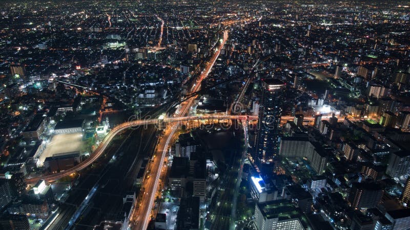 Cityscapenattsikt av Osaka royaltyfri foto