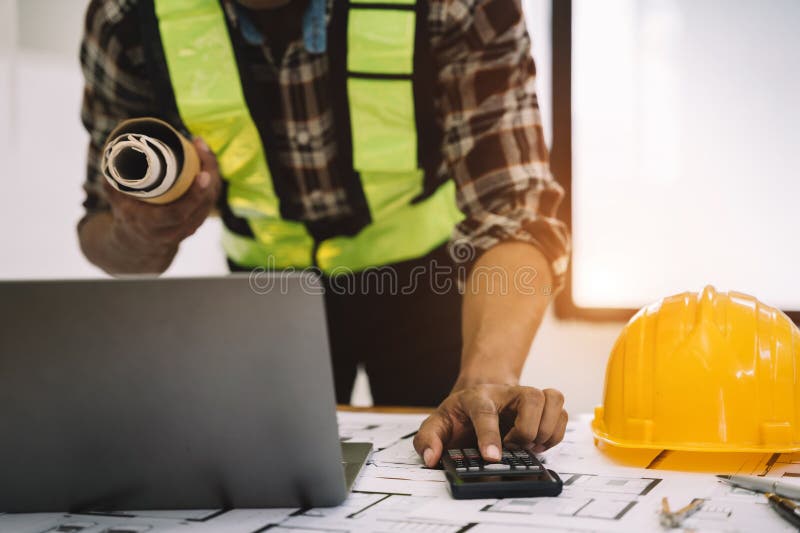 Civil Engineer or Architect Business Useing Calculator about Calculate the Cost with for Working