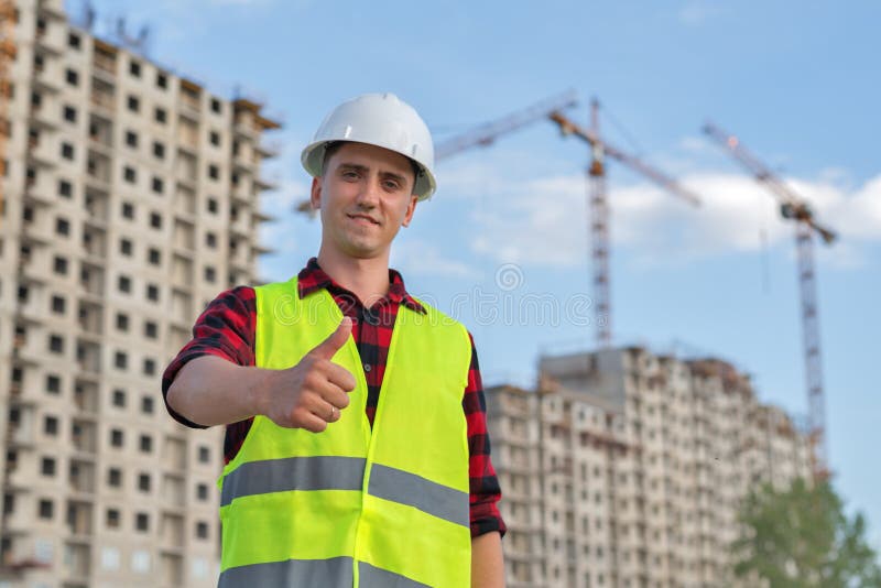 Civil Engineer in a White Helmet on the Background of Construction ...