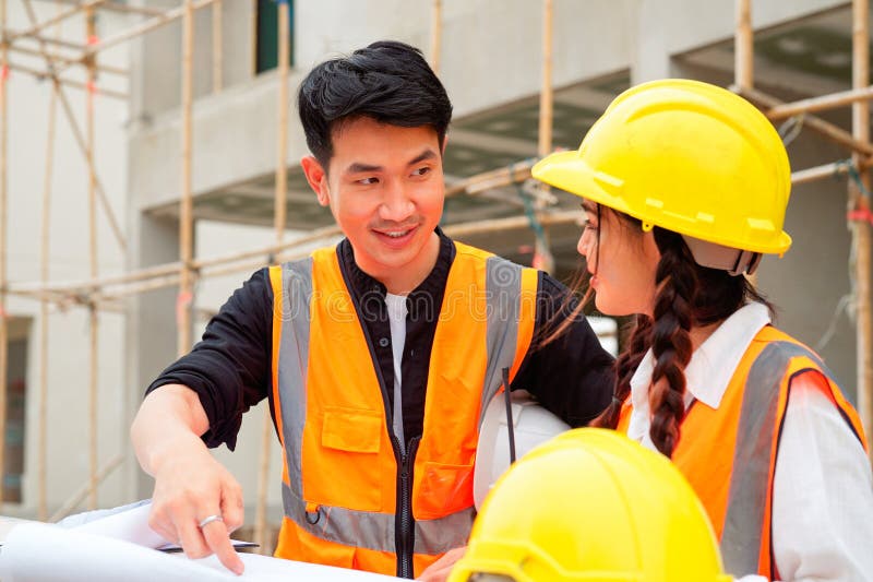 Civil Engineers Team with Safety Hard Hat Working Together at