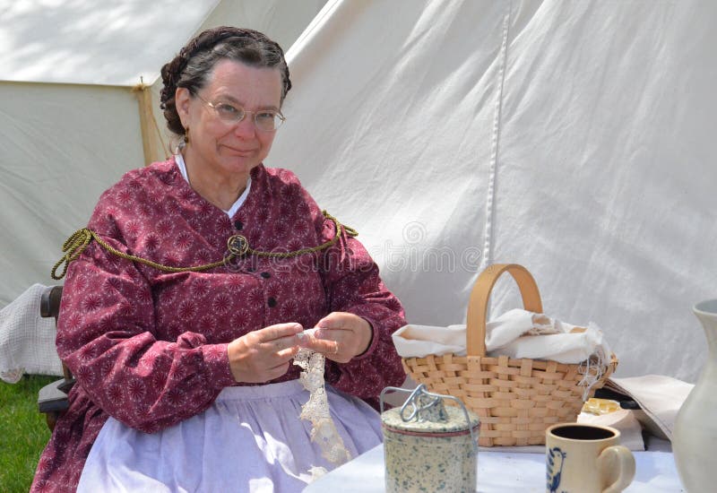 DEARBORN, MI - MAY 26: Civil-war era re-enactor tatting during the Civil War remembrance at Greenfield Village May 26, 2013. DEARBORN, MI - MAY 26: Civil-war era re-enactor tatting during the Civil War remembrance at Greenfield Village May 26, 2013.