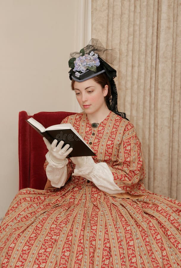 Reenactor playing young civil war era woman reading a book