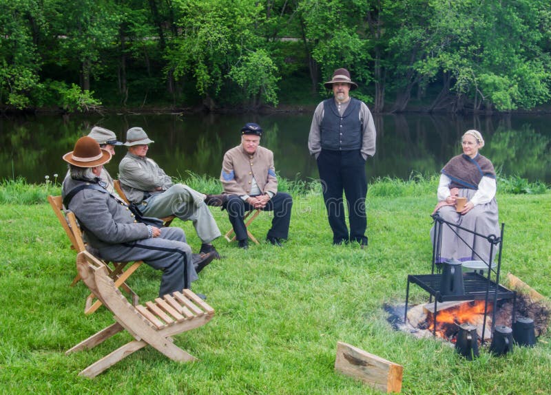 Buchanan, VA - April 30th; Civil War reenactor around a campfire at the Civil War History Weekend on April 30th, 2016, Buchanan, Virginia, USA. Buchanan, VA - April 30th; Civil War reenactor around a campfire at the Civil War History Weekend on April 30th, 2016, Buchanan, Virginia, USA.