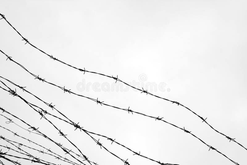clôture Frontière de sécurité avec le barbelé laissé prison Épines bloc Un prisonnier Camp de concentration d'holocauste prisonni image stock clôture Frontière de sécurité avec le barbelé laissé prison Épines bloc Un prisonnier Camp de concentration d'holocauste prisonni image stock