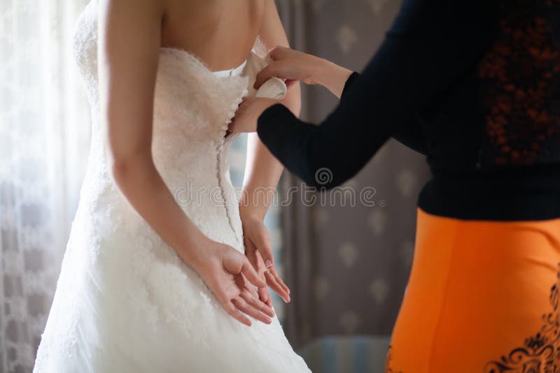 Clasp wedding dress. stock photo. Image of clothing 151968936