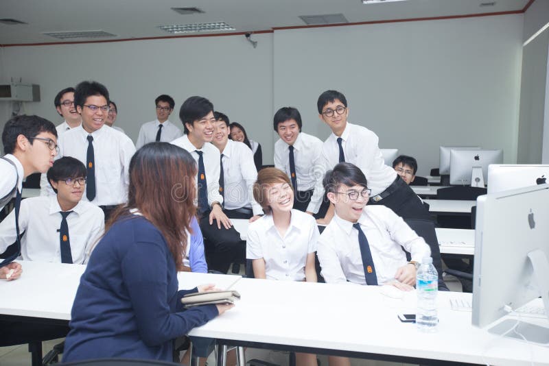 A class of students in front of their screens study computer science. royalty free stock photo