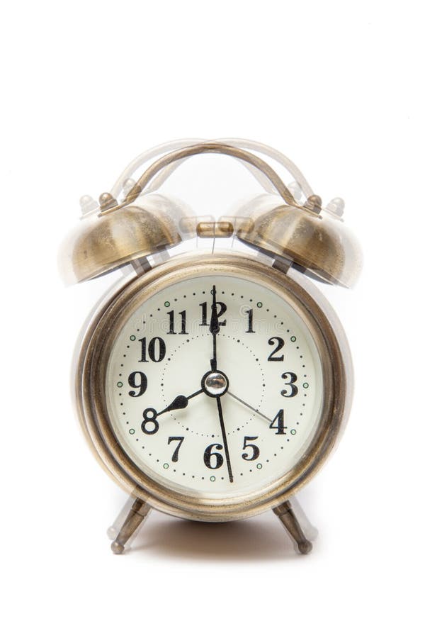 Classic alarm clock ringing at eight o clock, isolated against a