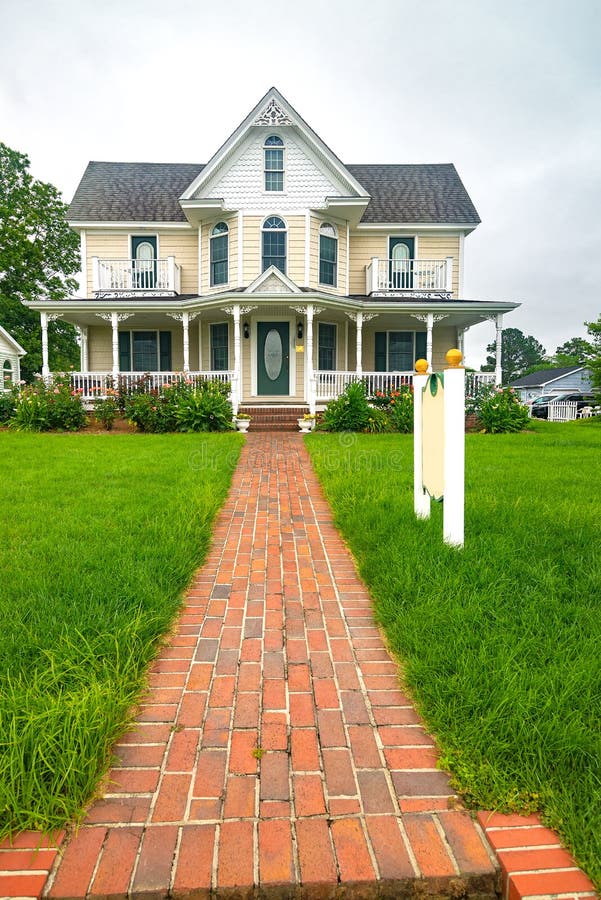 Classic American House with a Brick Sidewalk Leading To the Front Door ...