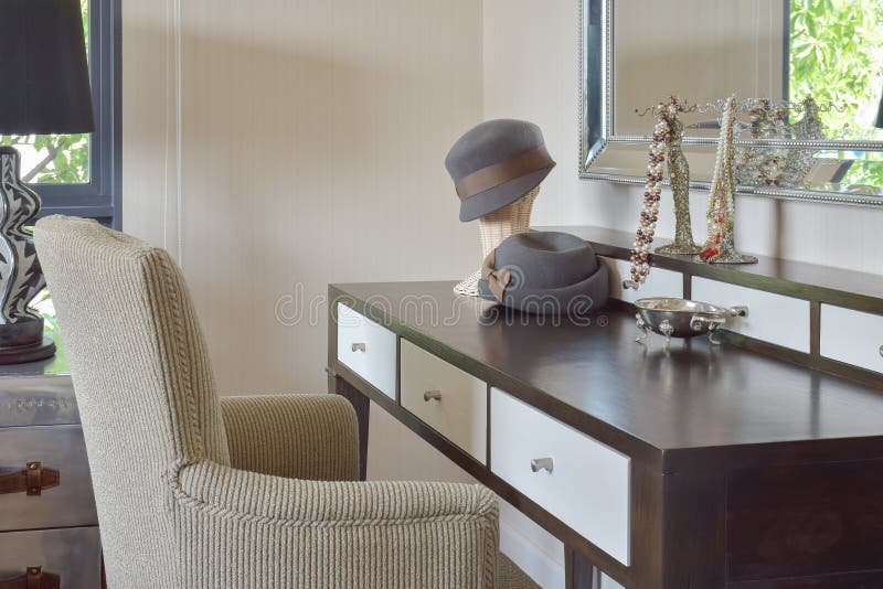 Classic Brown Chair with Jewelry Set on Dressing Table Stock Photo