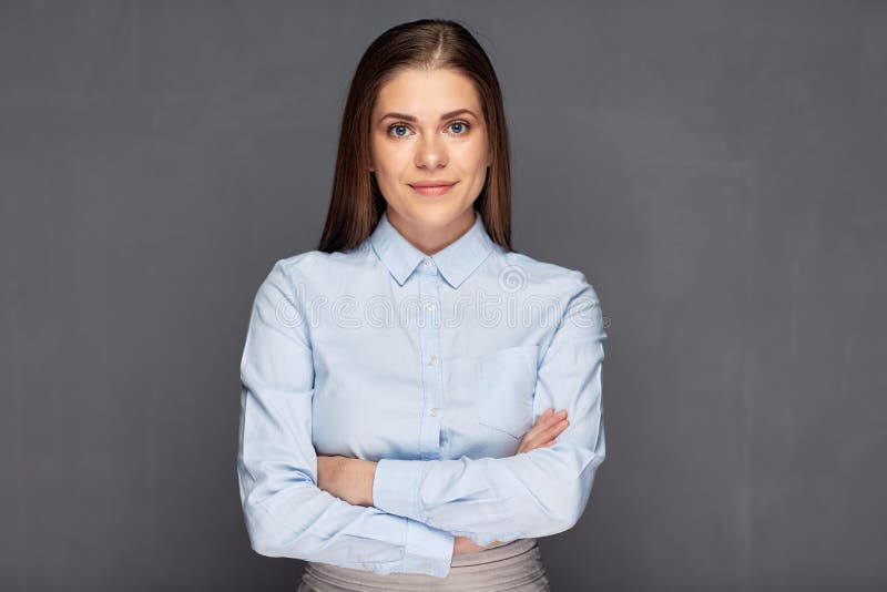 Classic business portrait of young woman with crossed arms.