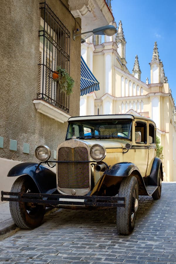 Classic car in a cobblestone street in Old Havana