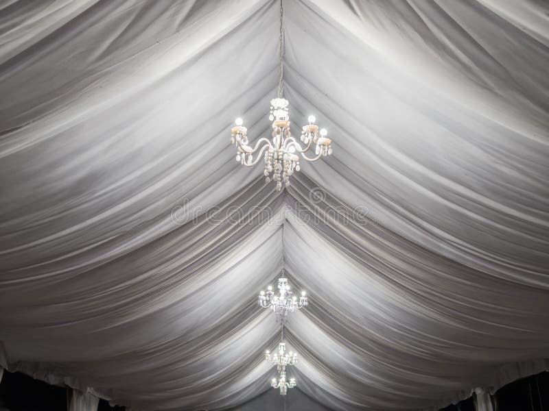 Classic chandeliers on party tent