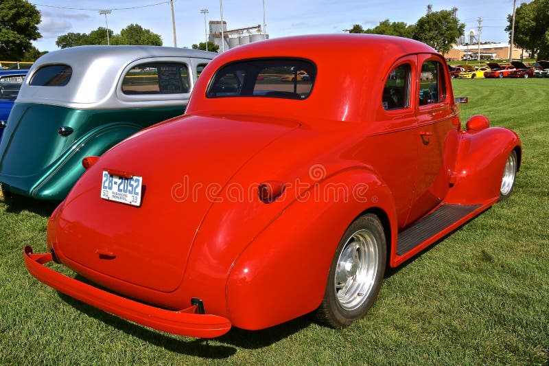 YANKTON, SOUTH DAKOTA, August 16, 2019: A classic red restored 1939 Chevrolet coupe is displayed at the annual car show as Riverboat Days celebrates on the third weekend of August. YANKTON, SOUTH DAKOTA, August 16, 2019: A classic red restored 1939 Chevrolet coupe is displayed at the annual car show as Riverboat Days celebrates on the third weekend of August.