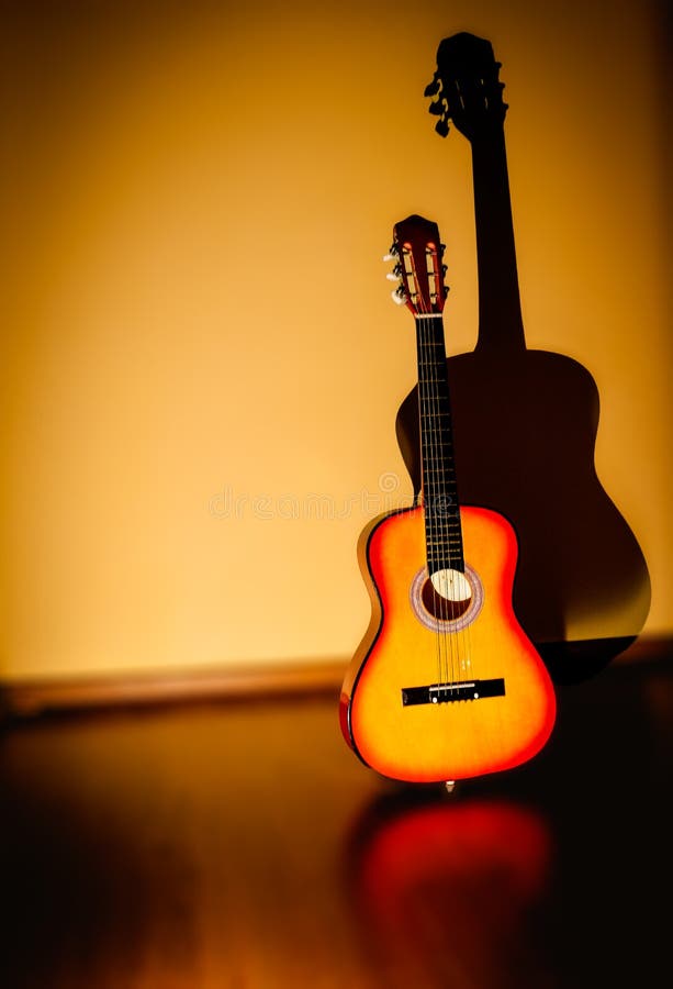 Classic Guitar Standing Near To a Wall and a Blurry Background Stock Photo  - Image of guitar, backgroundnguitar: 185069430