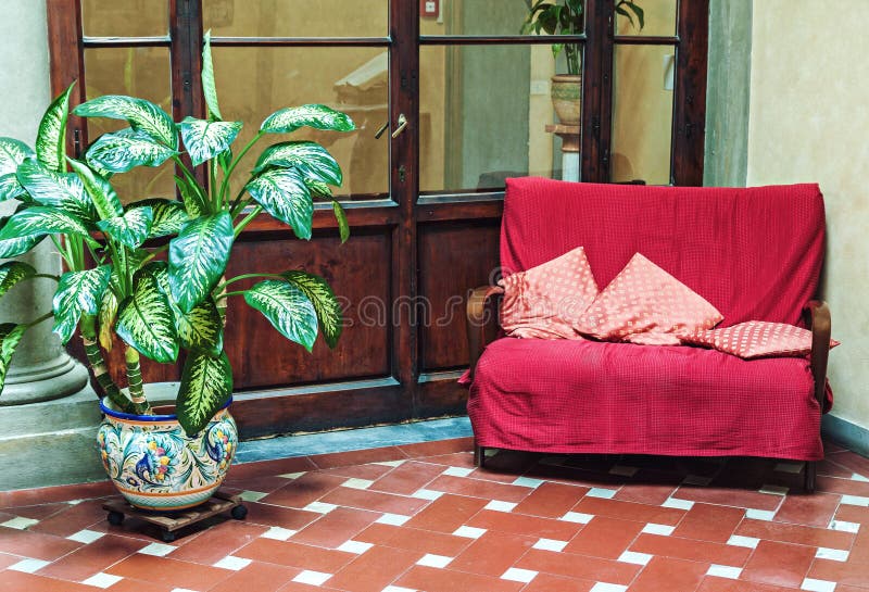 Classic interior with vintage couch and potted plant stock photo Classic interior with vintage couch and potted plant stock photo