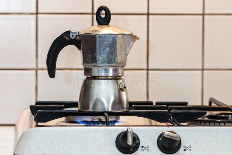 Moka Coffee Maker Pot On Gas Stove. Stock Photo, Picture and